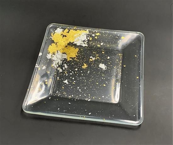 Clear glass square plate with gold and silver leaf, angled view
