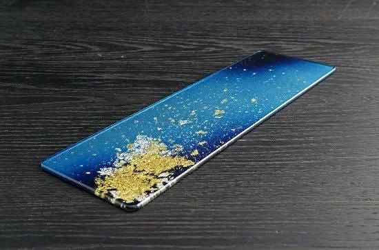 Gradient blue gold leaf plate, angled view