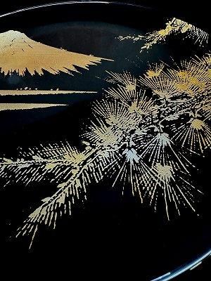 Close-up of the golden Mount Fuji and pine design