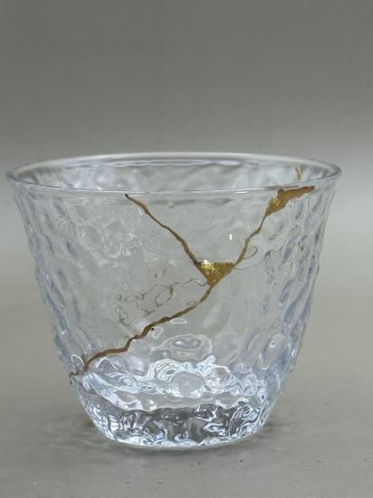Clear textured cold tea glass with gold kintsugi seams